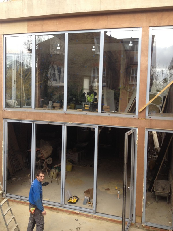 Aluminium bi-fold doors with two-storey glazing in Totteridge