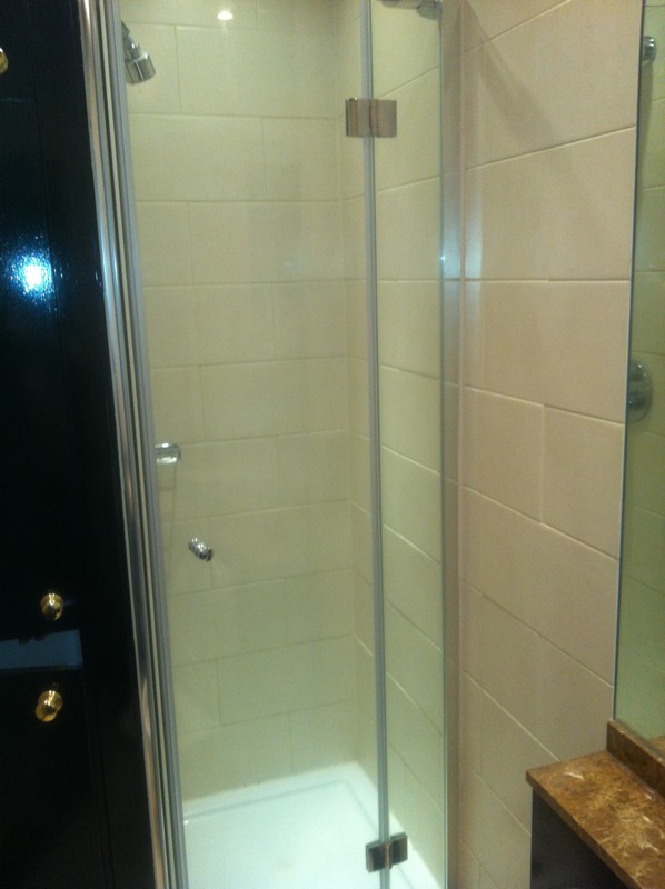 Frameless glass shower enclosure with chrome fittings in Totteridge