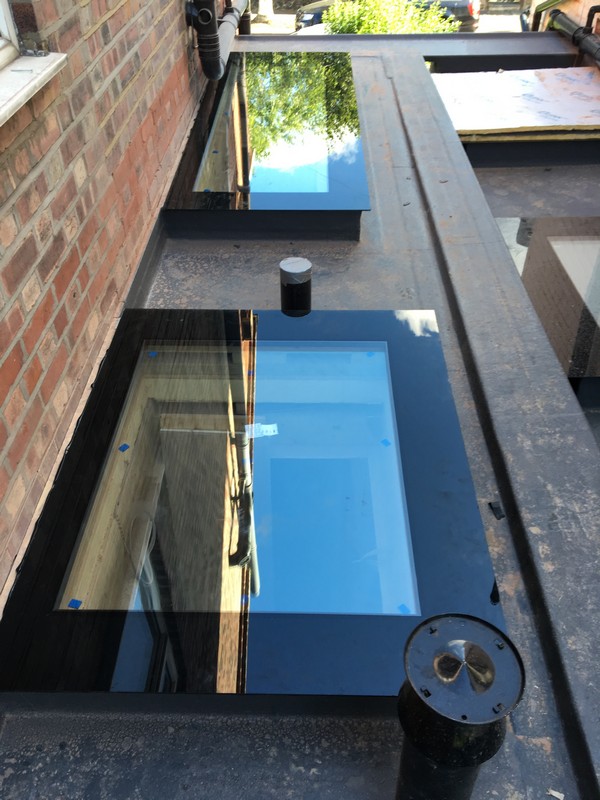 Multiple flat roof skylights on extension in Totteridge